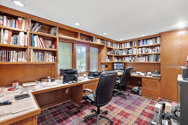 home office featuring brick floor, recessed lighting, and built in study area