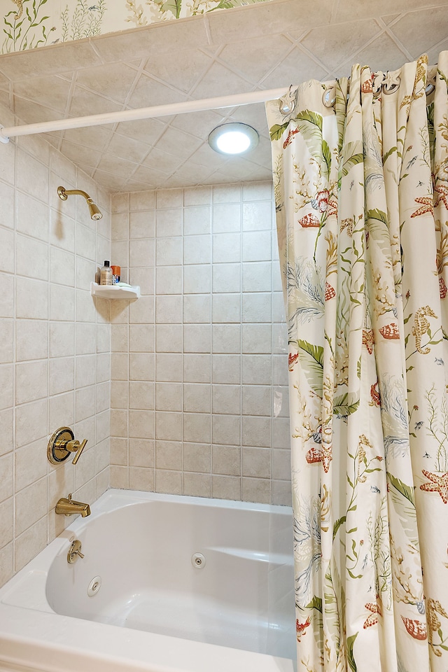 bathroom with a combined bath / shower with jetted tub