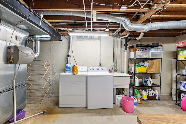 laundry room with laundry area and washing machine and clothes dryer