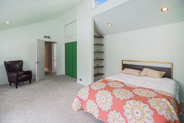 carpeted bedroom featuring high vaulted ceiling