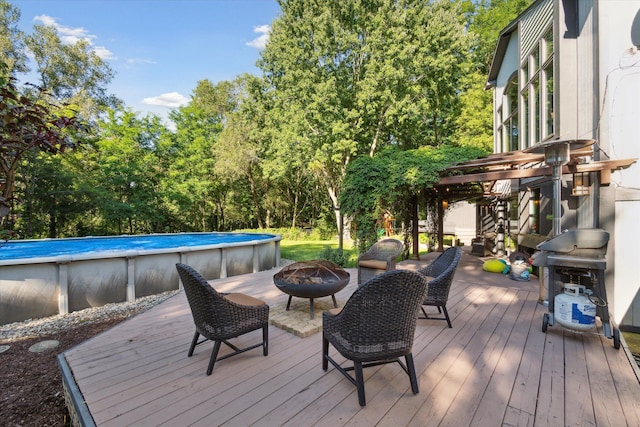 deck with an outdoor fire pit