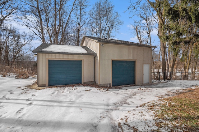 view of snow covered garage