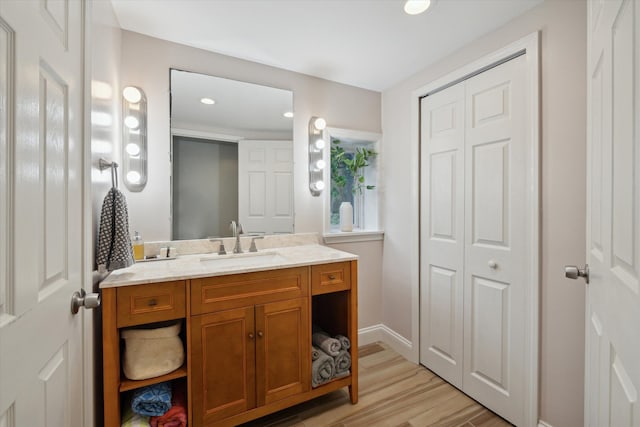 bathroom featuring wood-type flooring and vanity