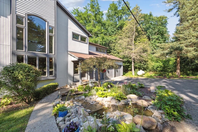 view of side of home with a garage