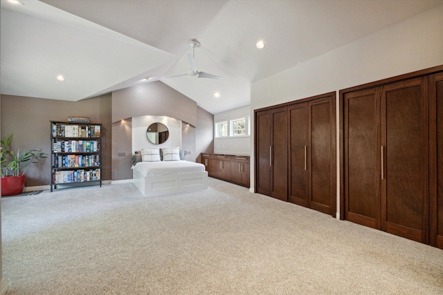 unfurnished bedroom with carpet and vaulted ceiling