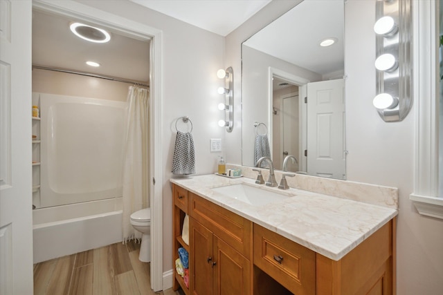 full bathroom featuring shower / bath combo, toilet, vanity, and wood-type flooring