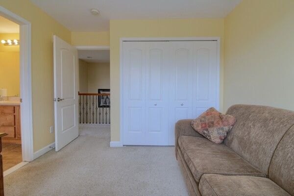9077 Chambord Dr, Ypsilanti, MI 48197 - living room with baseboards and light colored carpet