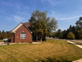 9077 Chambord Dr, Ypsilanti, MI 48197 - exterior space featuring a yard