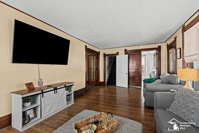 living room with dark hardwood / wood-style flooring