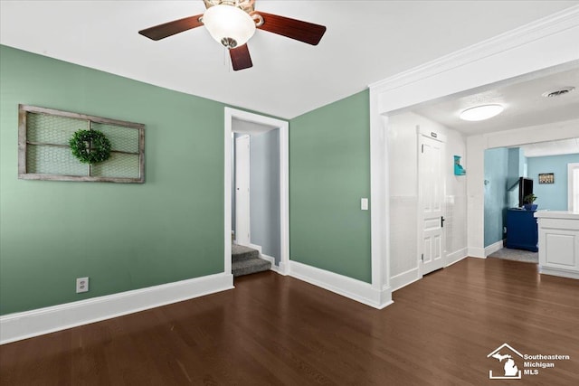 interior space featuring ceiling fan and dark hardwood / wood-style floors