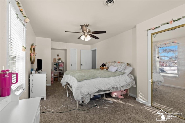 carpeted bedroom with ceiling fan