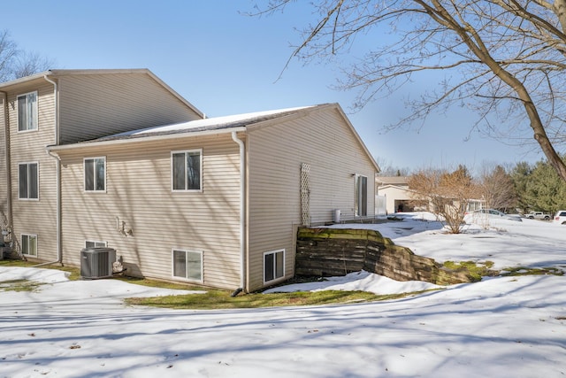 view of snow covered exterior with central air condition unit