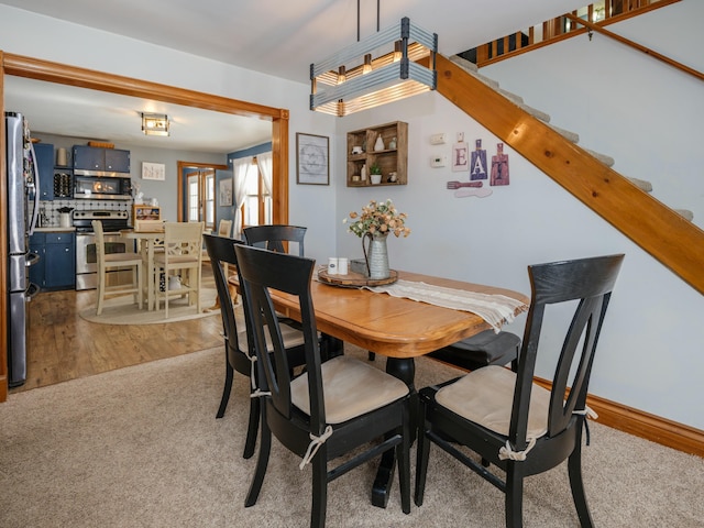 dining area with light wood-type flooring