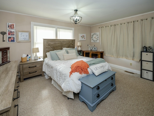 bedroom with crown molding and an inviting chandelier