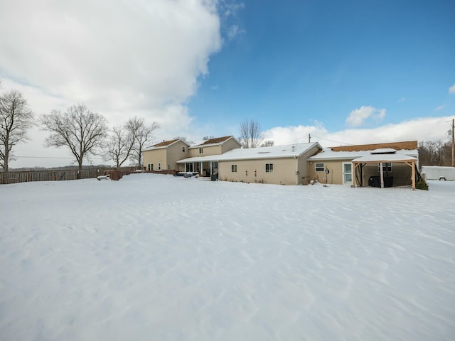 view of snow covered house