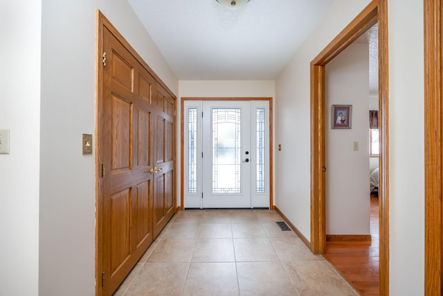 entrance foyer with light tile patterned flooring