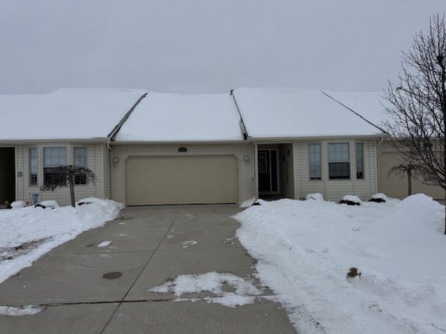 ranch-style home with a garage