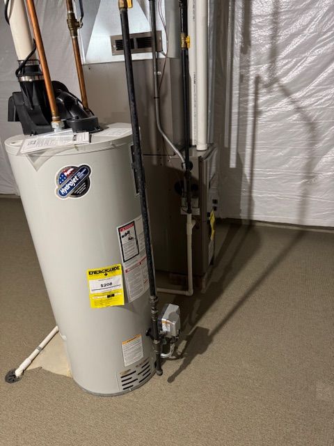 utility room featuring gas water heater