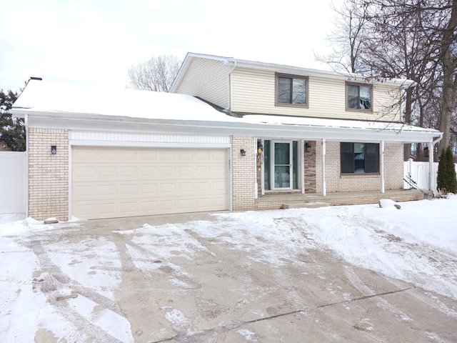 view of front of home with a garage and brick siding