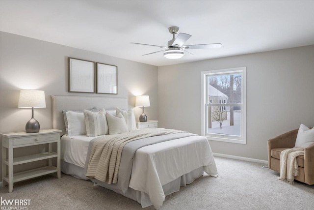 bedroom featuring light carpet and ceiling fan