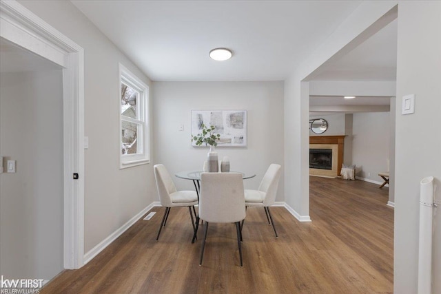 dining area featuring wood-type flooring