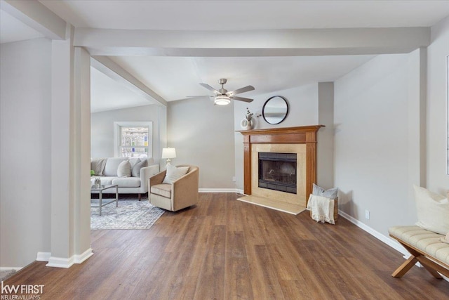 living room featuring ceiling fan, dark wood-type flooring, and lofted ceiling with beams