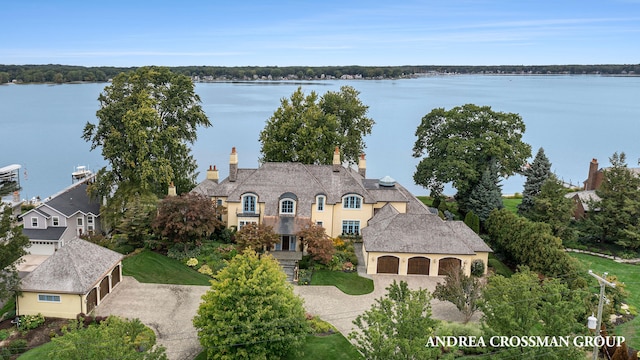 birds eye view of property with a water view