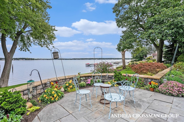 view of patio with a water view