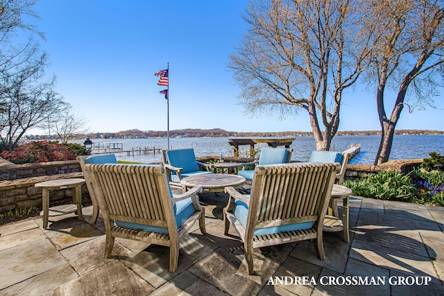 view of patio with a water view