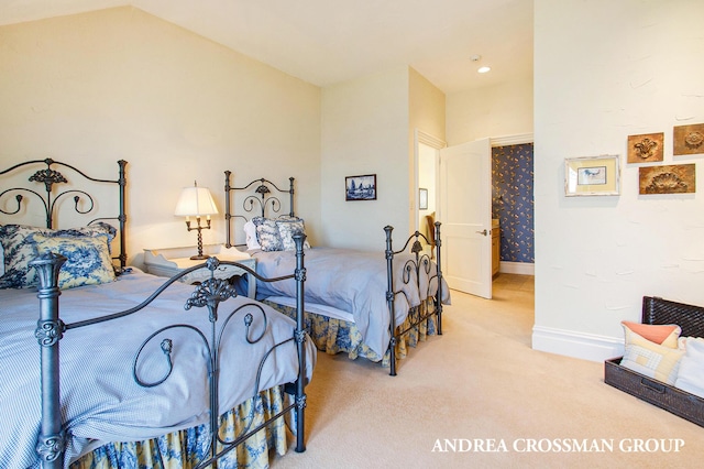 carpeted bedroom featuring lofted ceiling