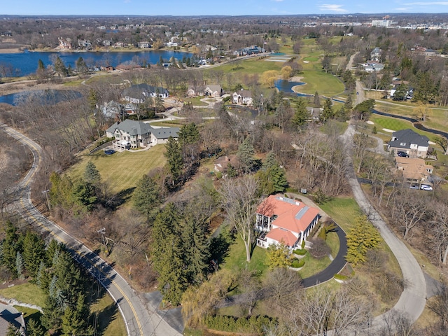 birds eye view of property featuring a water view and a residential view