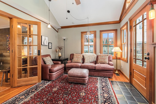 living room with lofted ceiling, crown molding, dark hardwood / wood-style floors, and ceiling fan