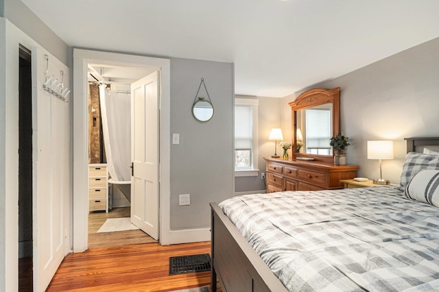 bedroom with light hardwood / wood-style floors