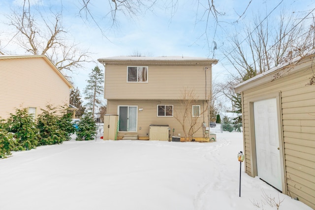 snow covered property featuring entry steps