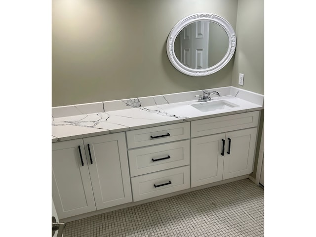 bathroom with tile patterned floors and vanity