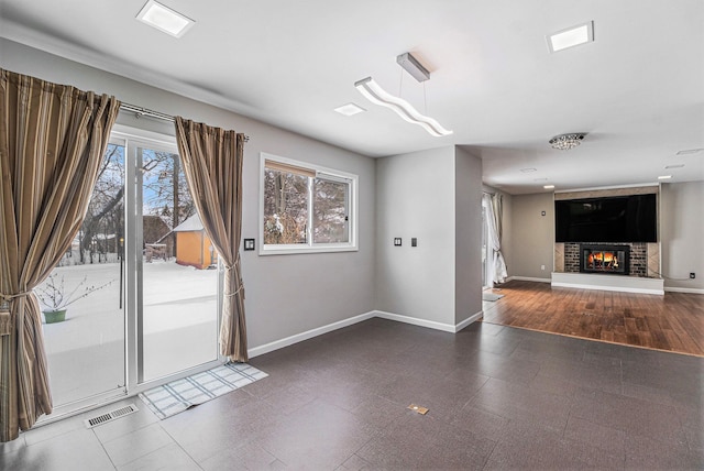 interior space featuring a fireplace and plenty of natural light