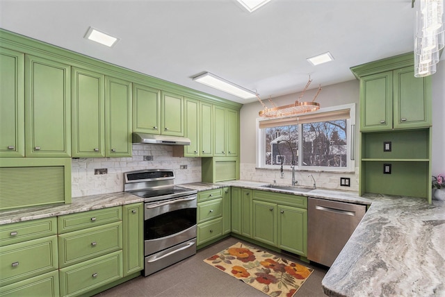 kitchen with sink, appliances with stainless steel finishes, tasteful backsplash, and light stone counters