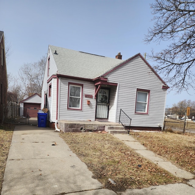 20529 Irvington St, Highland Park, MI 48203 - bungalow featuring a chimney, fence, an outbuilding, and roof with shingles