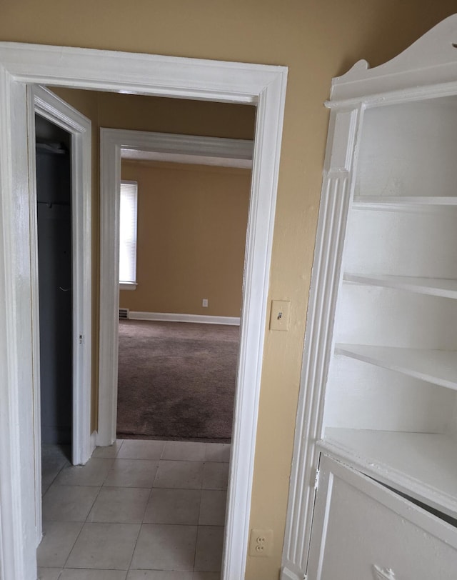 20529 Irvington St, Highland Park, MI 48203 - hall featuring light carpet, light tile patterned flooring, and baseboards