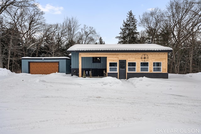 view of snow covered garage