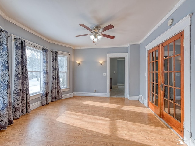 spare room with light hardwood / wood-style floors, ceiling fan, and ornamental molding