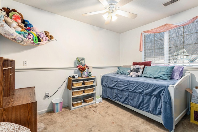 carpeted bedroom with ceiling fan