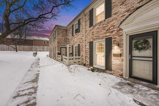 view of snow covered property