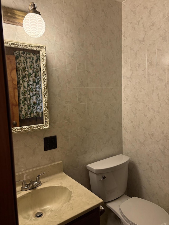 bathroom featuring toilet and vanity