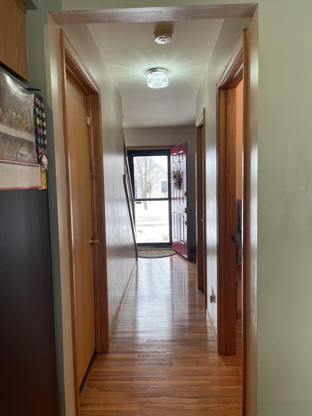 hall with light hardwood / wood-style floors