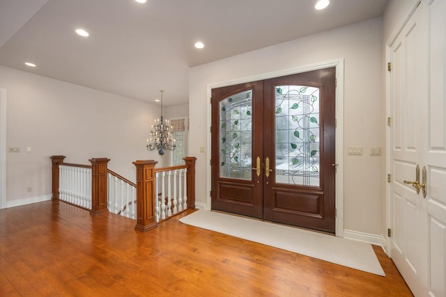 entrance foyer featuring french doors and wood-type flooring