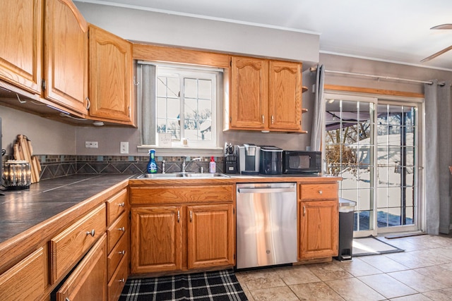 kitchen with dishwasher, plenty of natural light, a sink, and black microwave