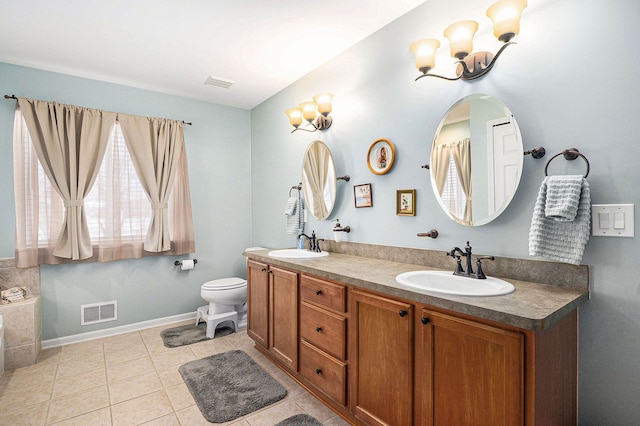 bathroom with vanity, a chandelier, tile patterned flooring, and toilet