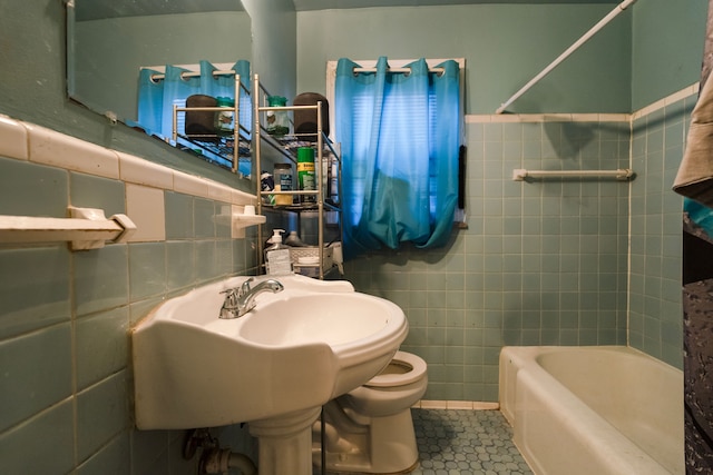 bathroom featuring tile walls, sink, tile patterned flooring, and toilet