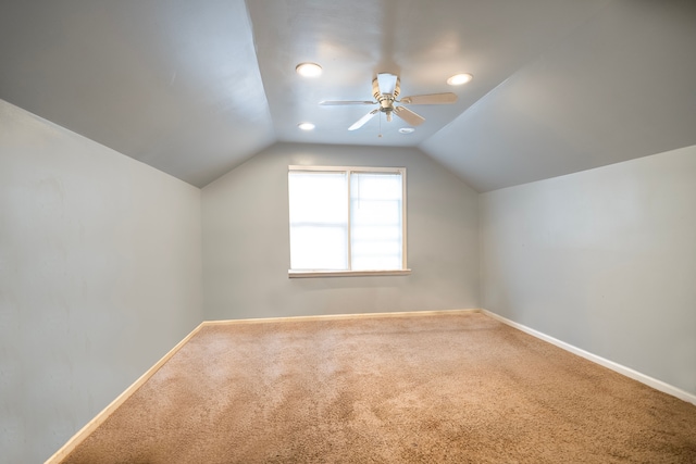 bonus room with lofted ceiling, ceiling fan, and carpet floors